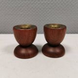 Two beautiful teak candle holders with brass inserts.