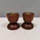Two beautiful teak candle holders with brass inserts.