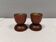 Two beautiful teak candle holders with brass inserts.