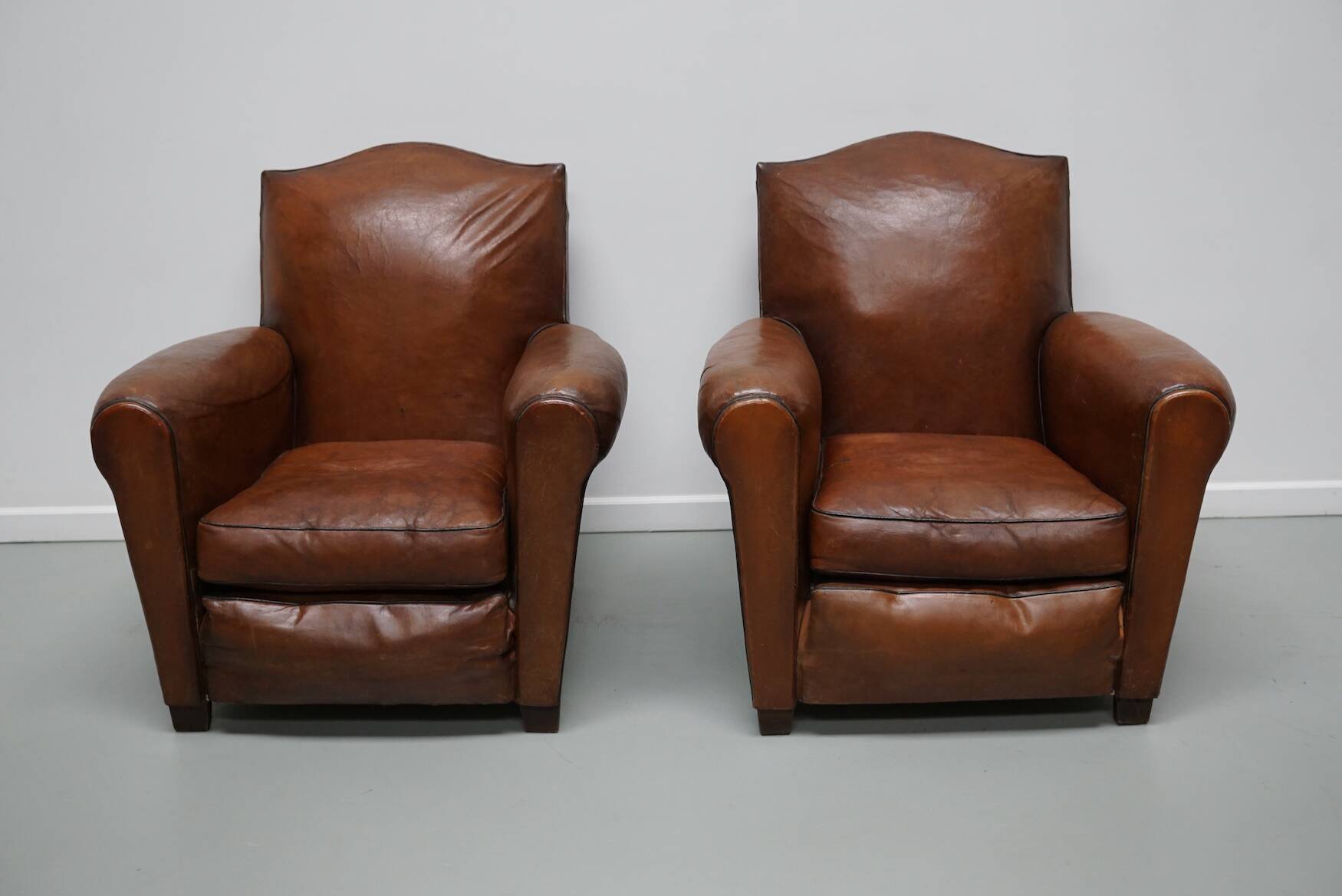 Pair of French Cognac Moustache Back Leather Club Chairs, 1940s