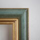 Frame in gilded and green wood