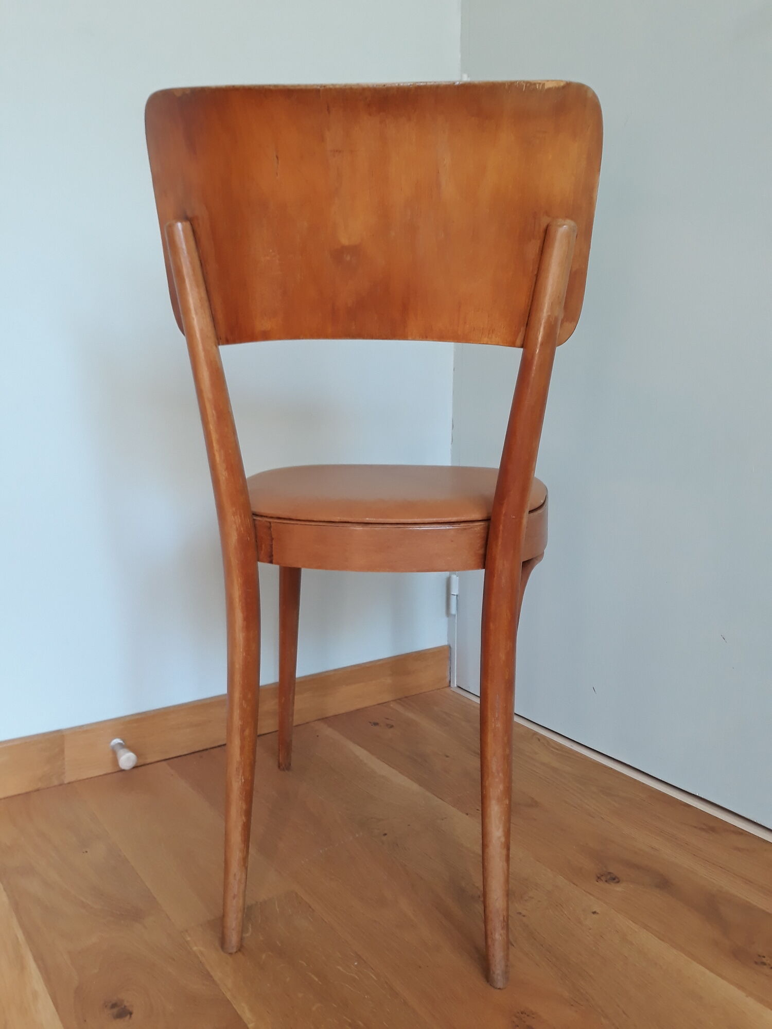 Bistro chair Baumann 1963 curved wood and skaï imitation leather caramel