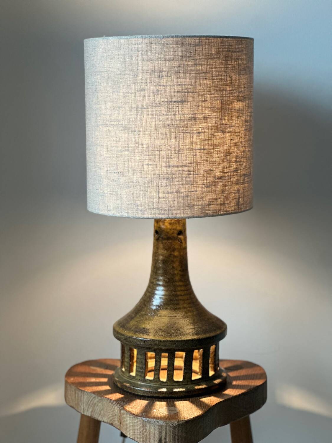 Vintage ceramic table lamp with integrated light base.