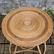 Pair of tripod coffee tables in rattan from the 1950s.