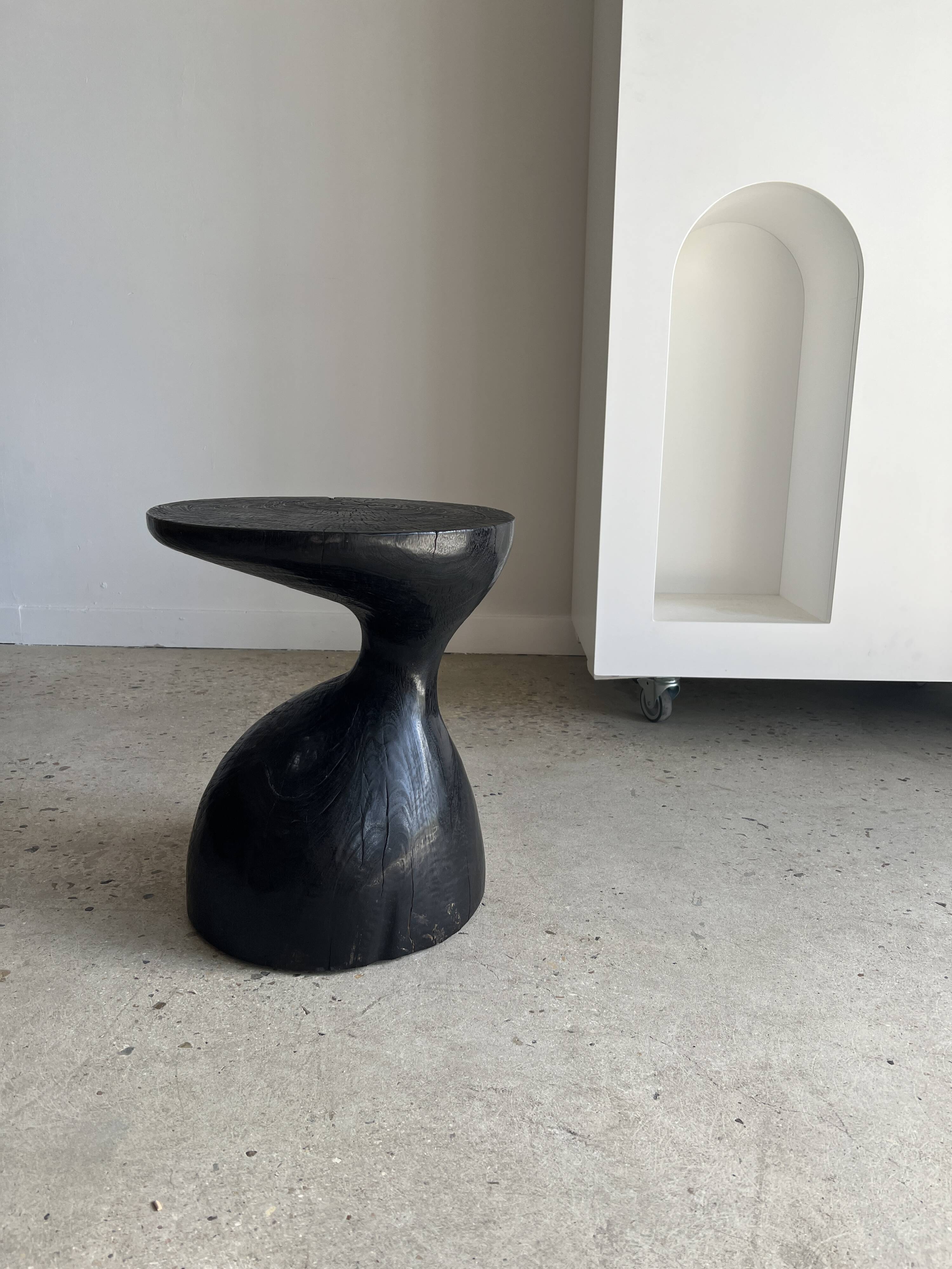 Solid wood (monoxyl) side table, organic shape, black color