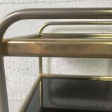 Small rolling trolley in brass and black plastic