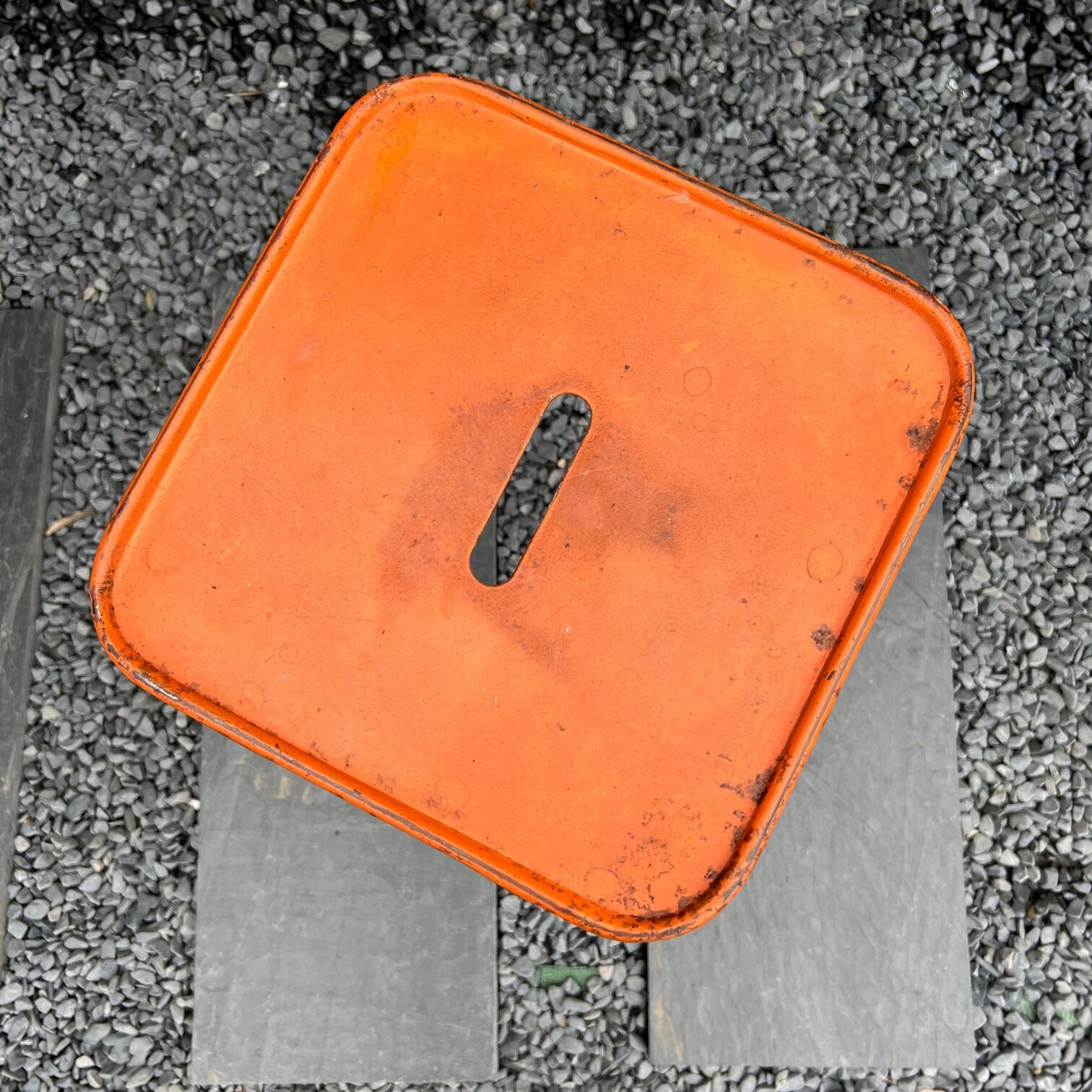 Orange metal workshop stool