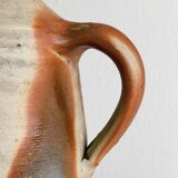 Old rustic stoneware bottle with handle