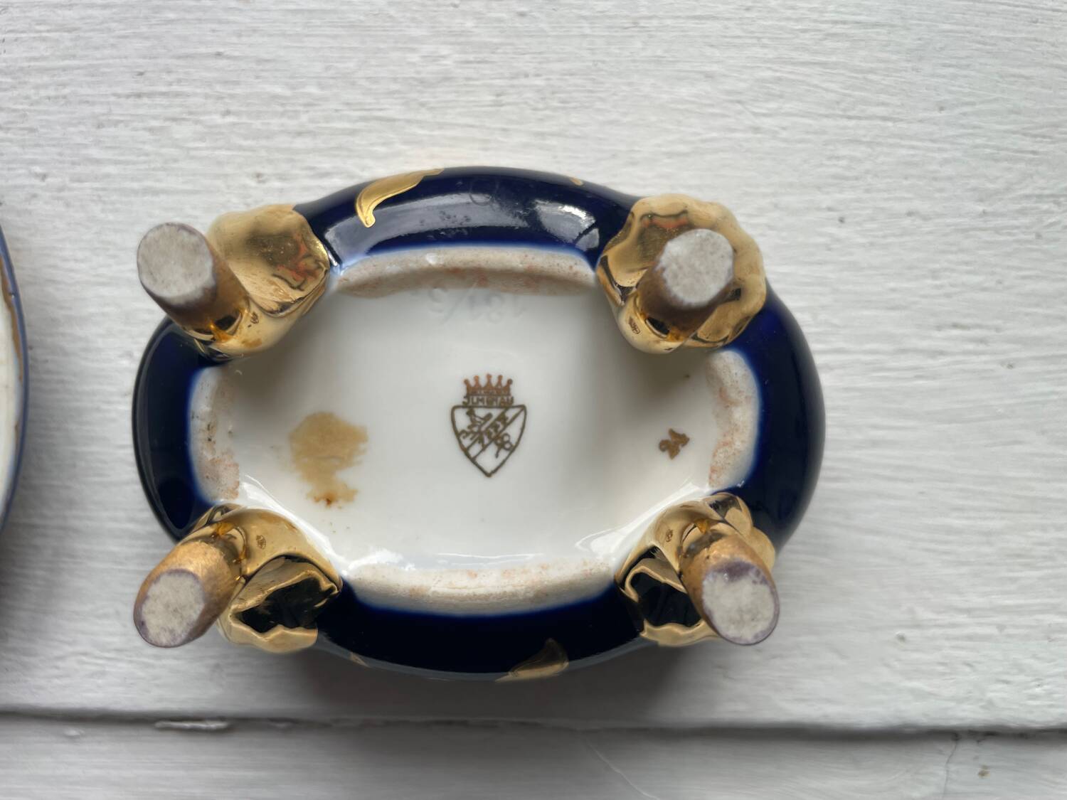 Cobalt blue and gold porcelain bonbonnière, signed JLMenau.