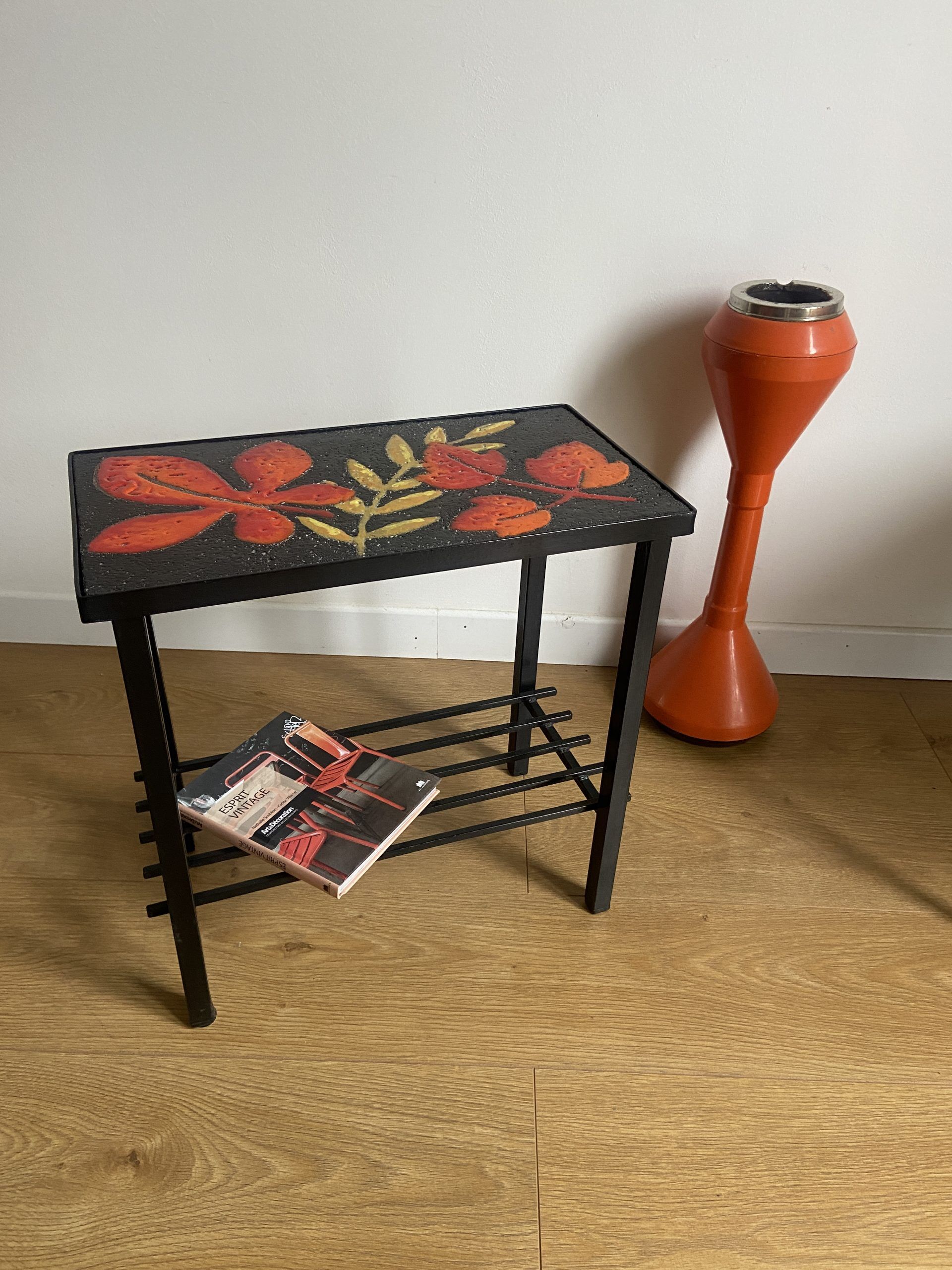 Side table or end of sofa in wrought iron and enamelled lava stone circa 1960