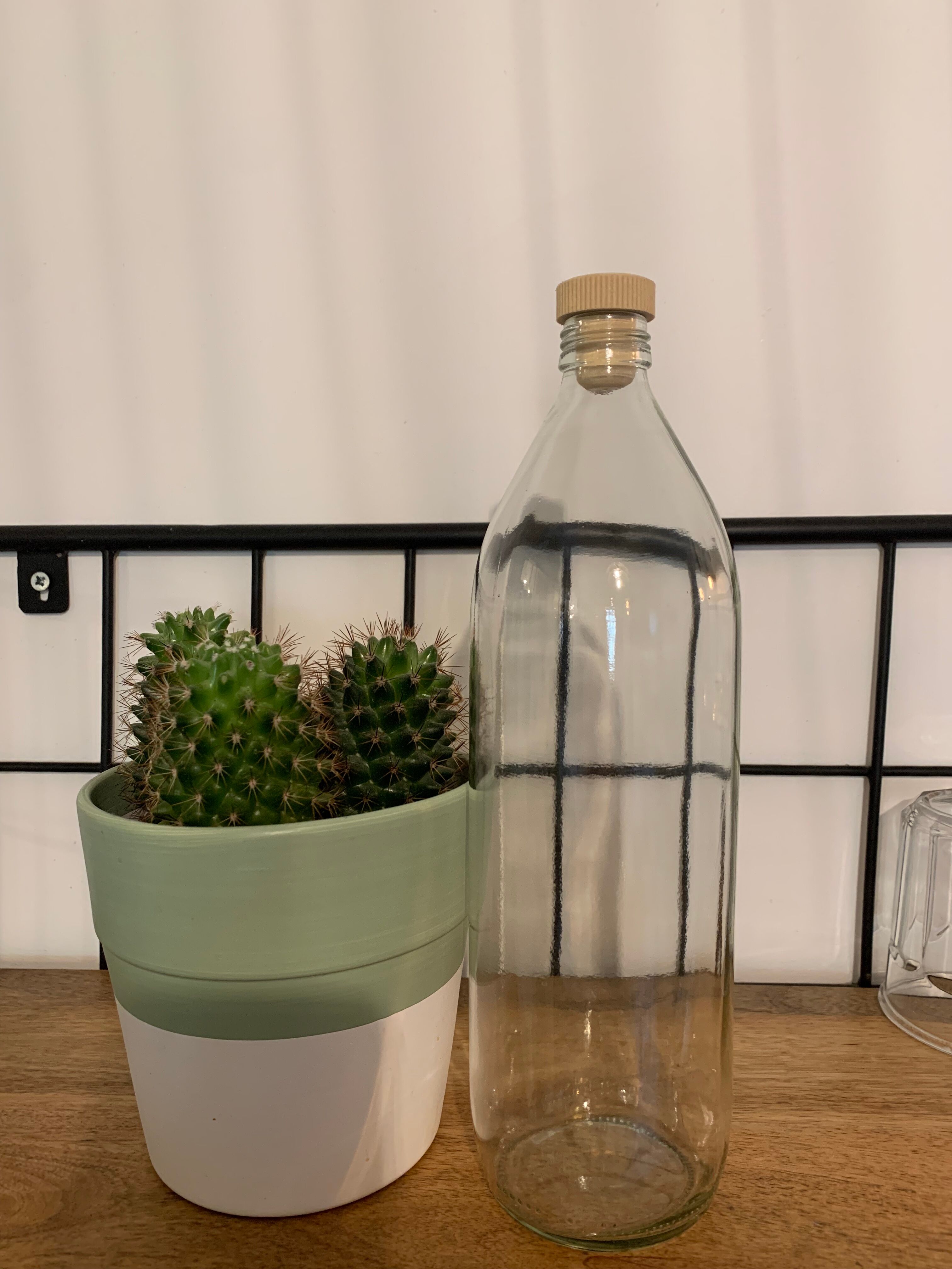 Antique glass bottle with a capacity of 1 litre and its beige cap - in very good condition!