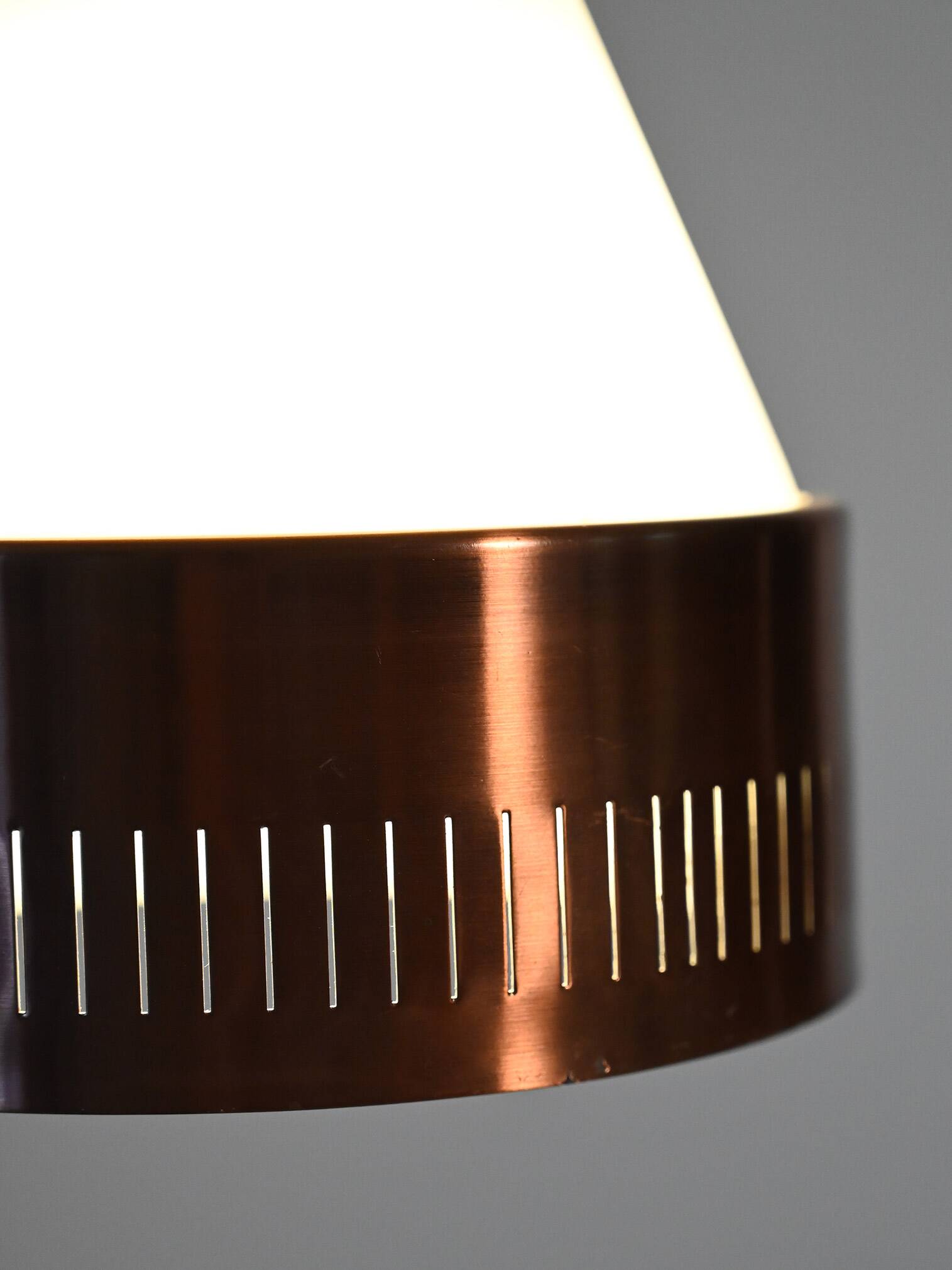 Scandinavian conic pendant lamp with copper detail