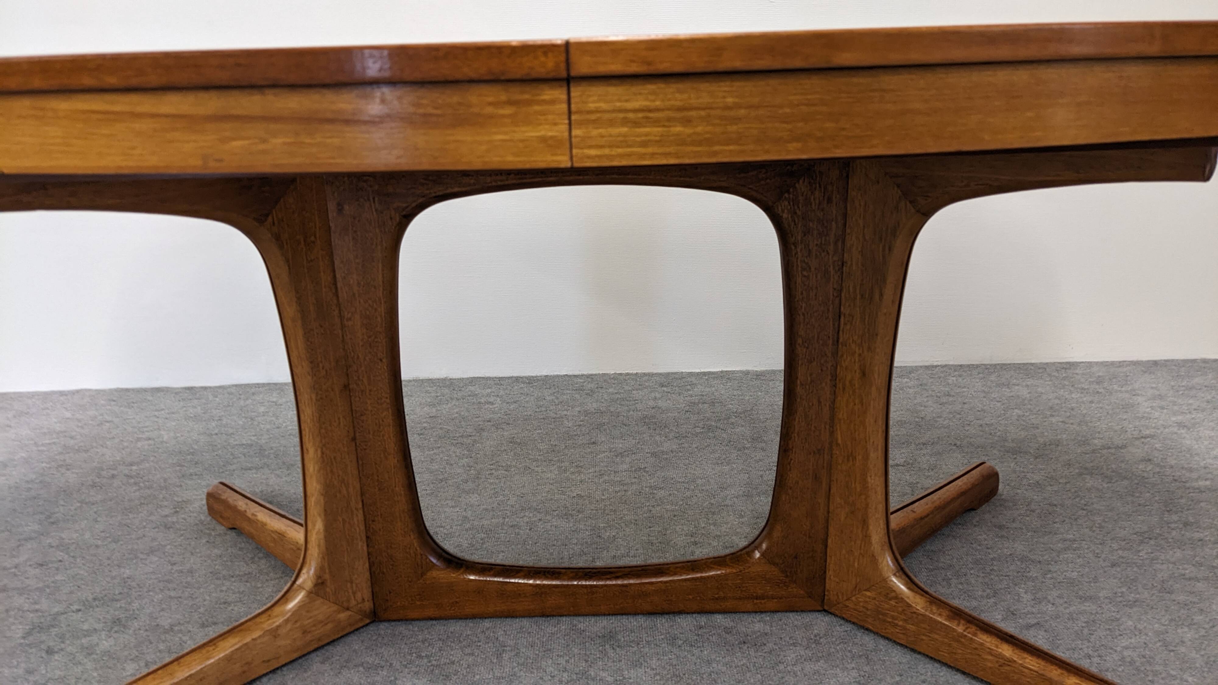 Oval extendable dining table by Baumann, France circa 1970.