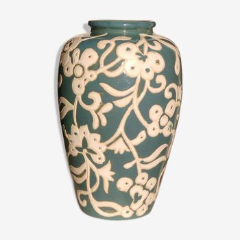 Blue water vase with white floral pattern