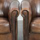 Set of two sheepskin club armchairs with fixed seat cushions