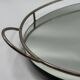 Oval chrome and mirror plateau, mid-century reflective piece.
