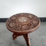 Carved wooden hunting stool decorated with vines