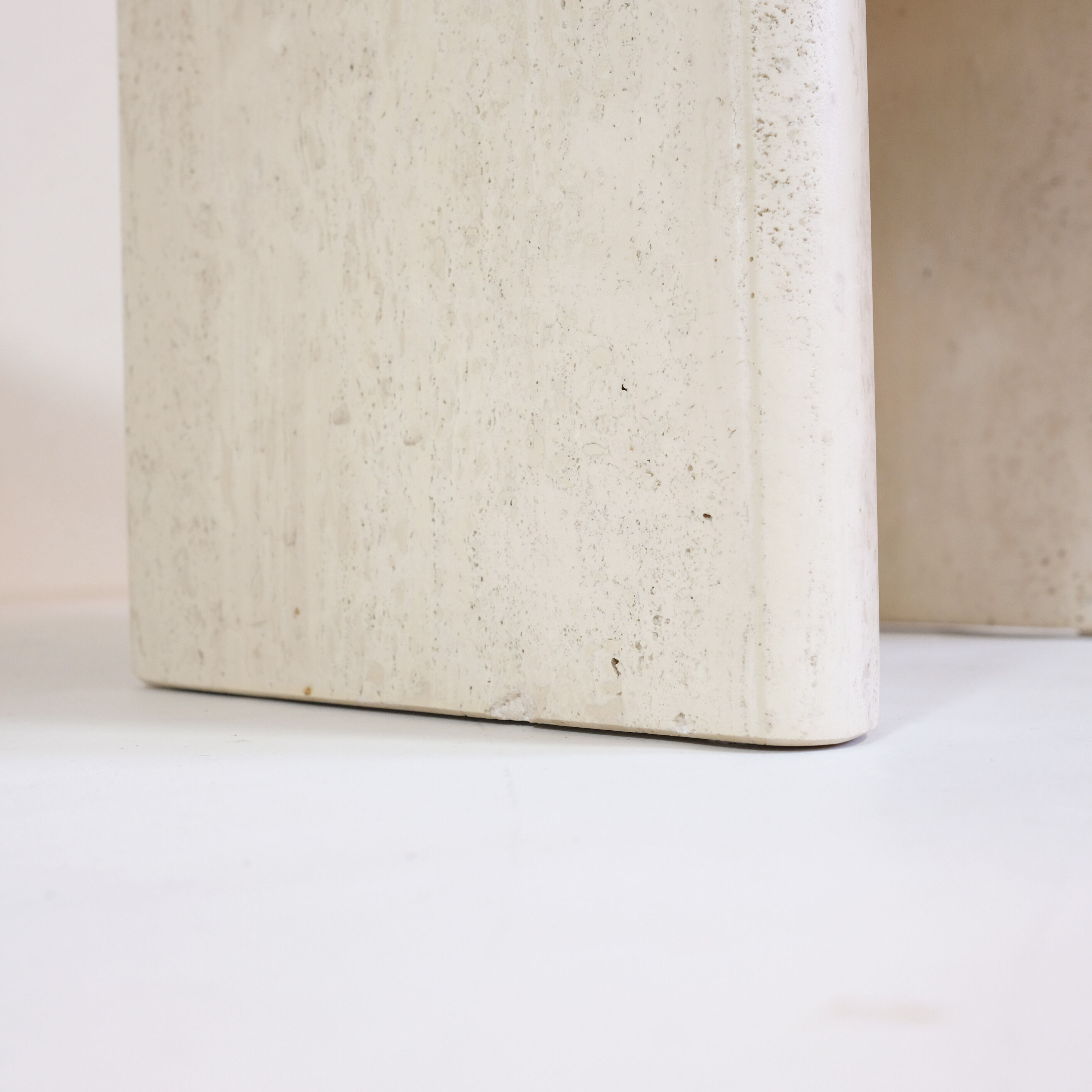 Pair of travertine trundle tables, Italy