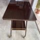 TV stand on casters, 2 brown Formica shelves, 1960s