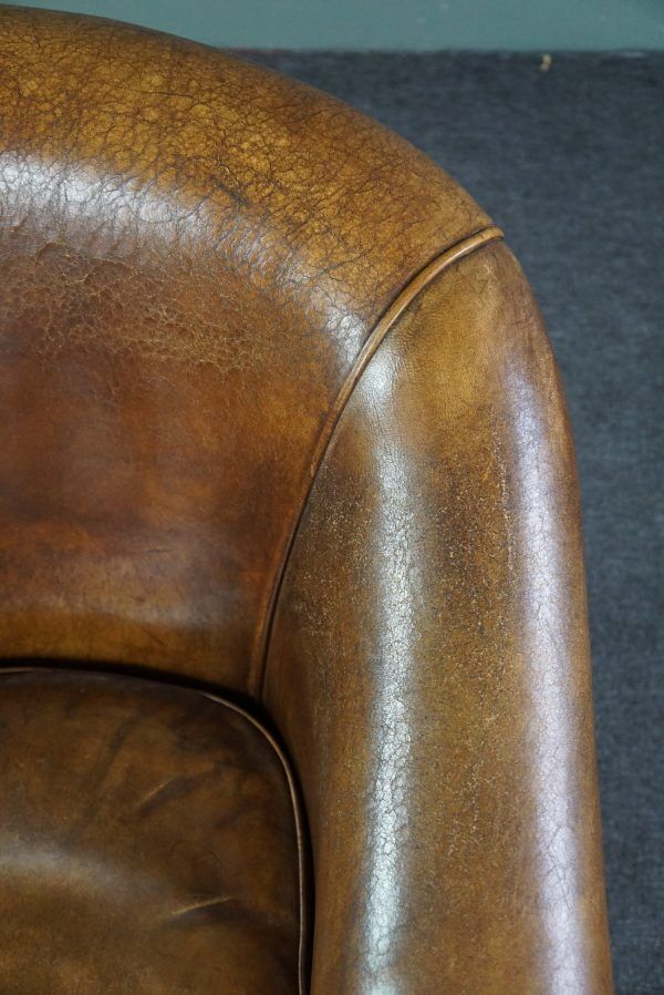 Club chair in patinated sheepskin