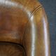 Club chair in patinated sheepskin
