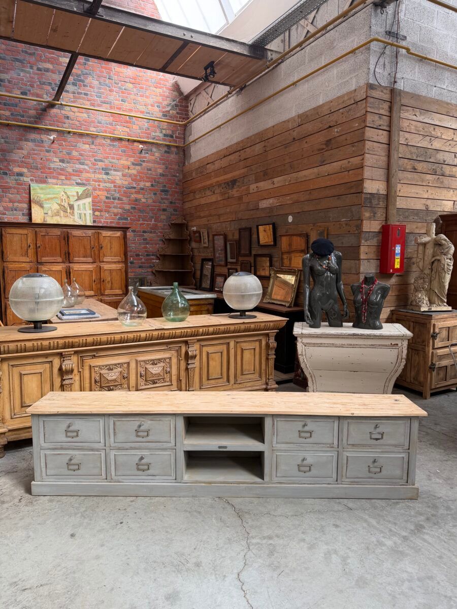 Old workshop furniture transformed into a TV unit.