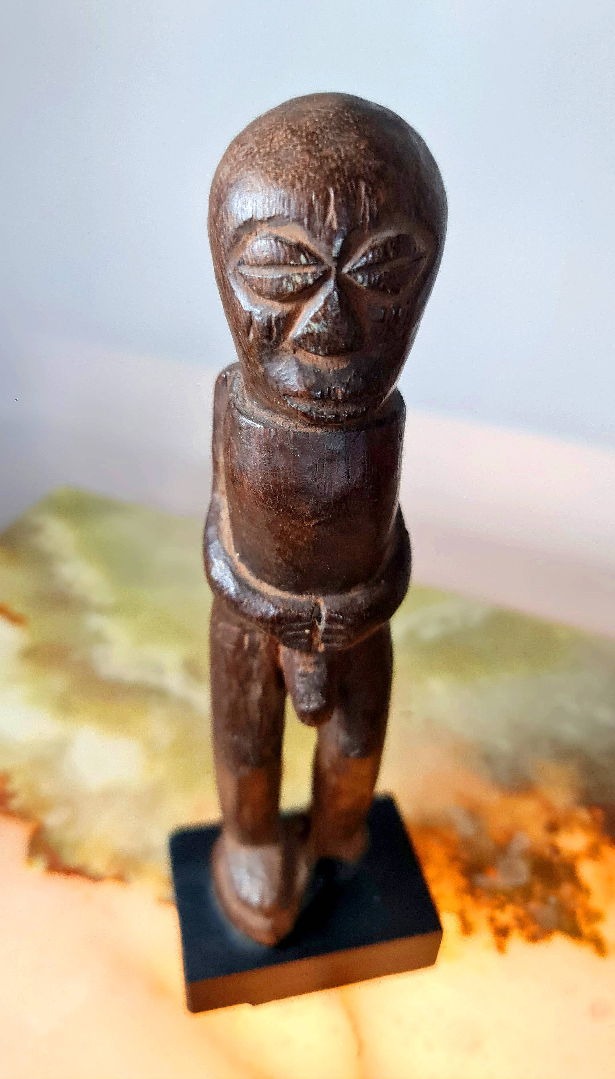 Old Fon statuette on a base, Benin