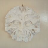 Bas relief sun in plaster