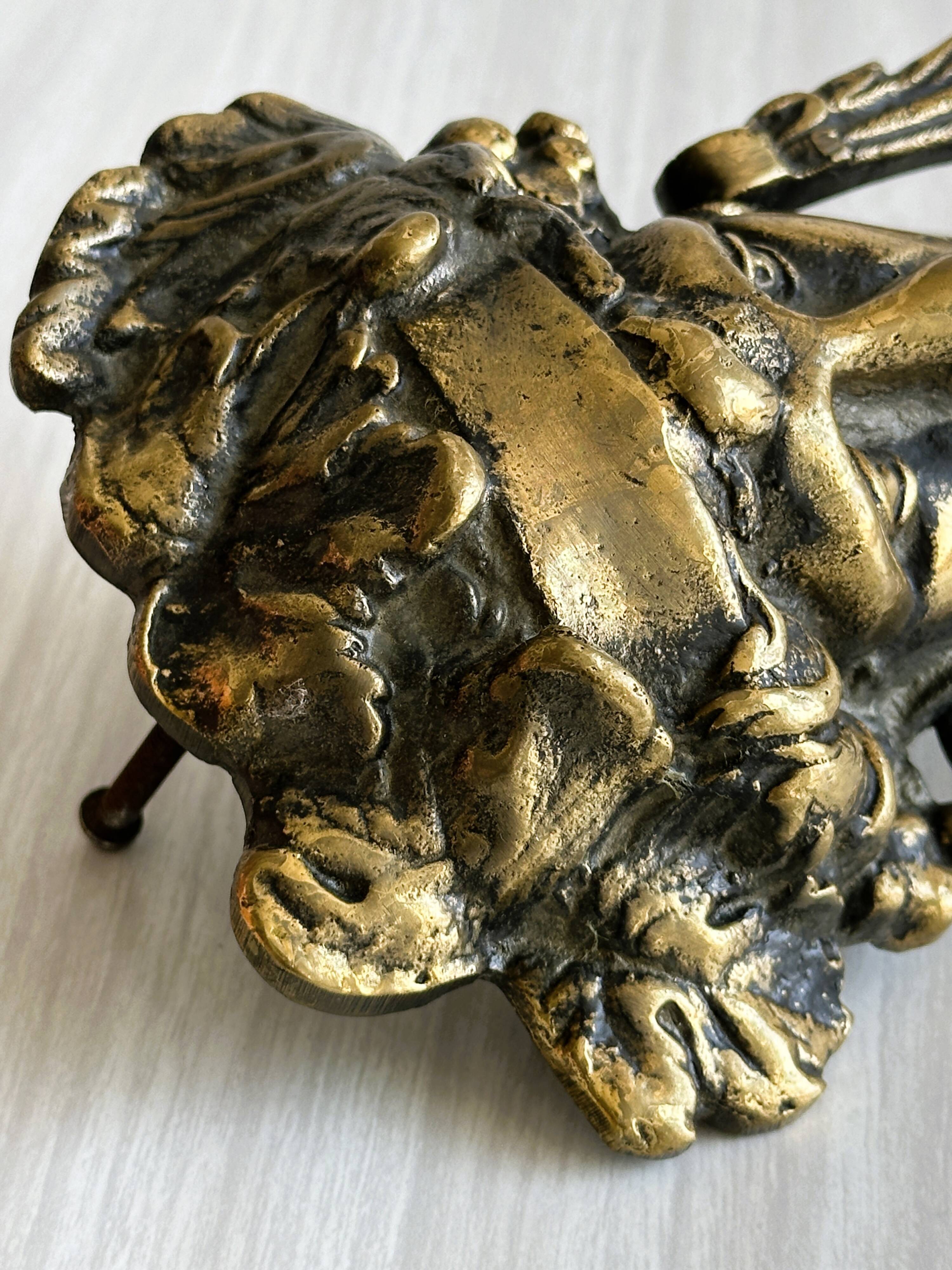 Large antique style brass metal knocker.