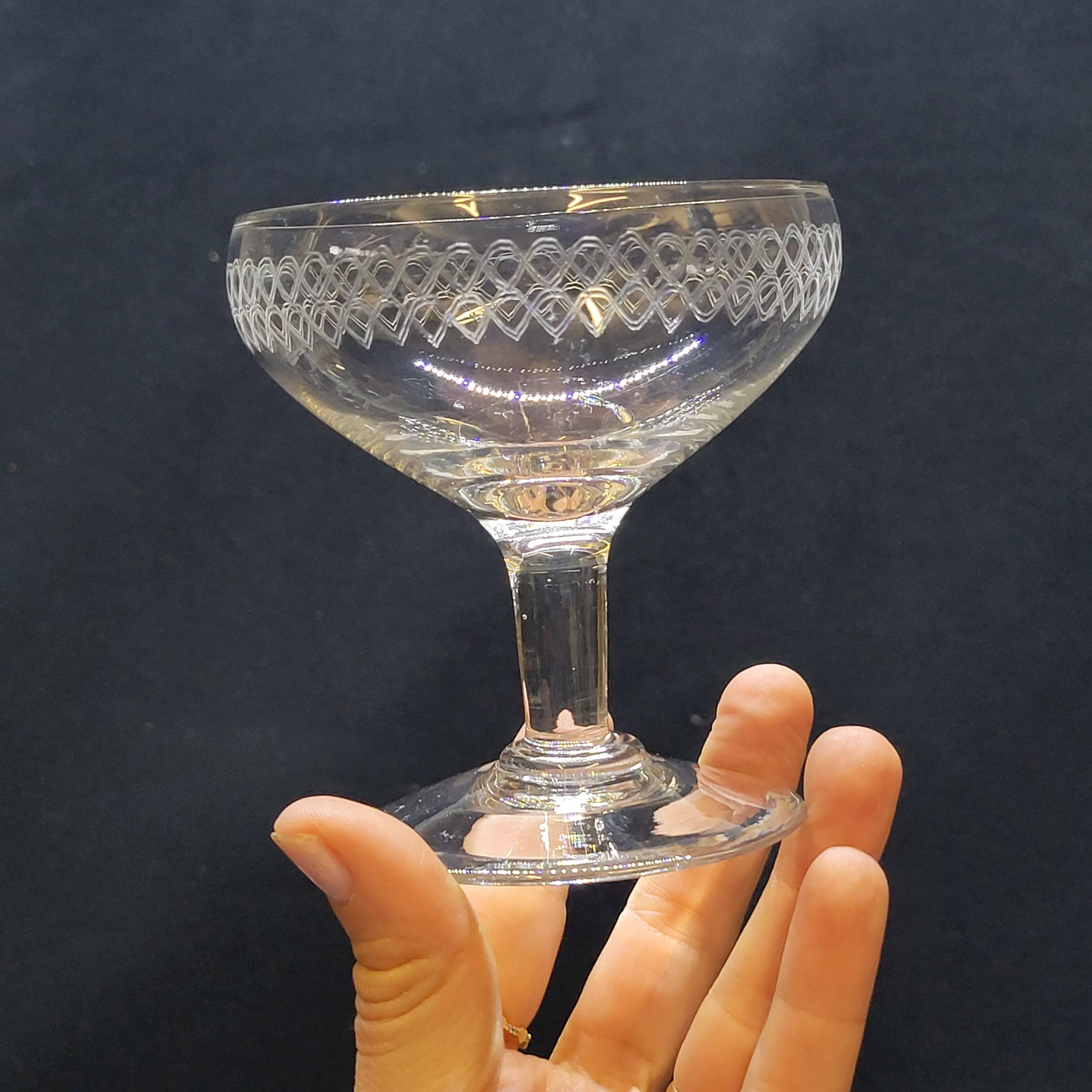 12 old champagne glasses in blown and engraved glass