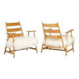 Pair of “lounge” armchairs in blond beech. 1950s