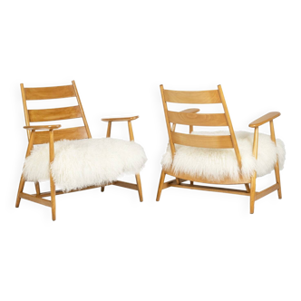 Pair of “lounge” armchairs in blond beech. 1950s