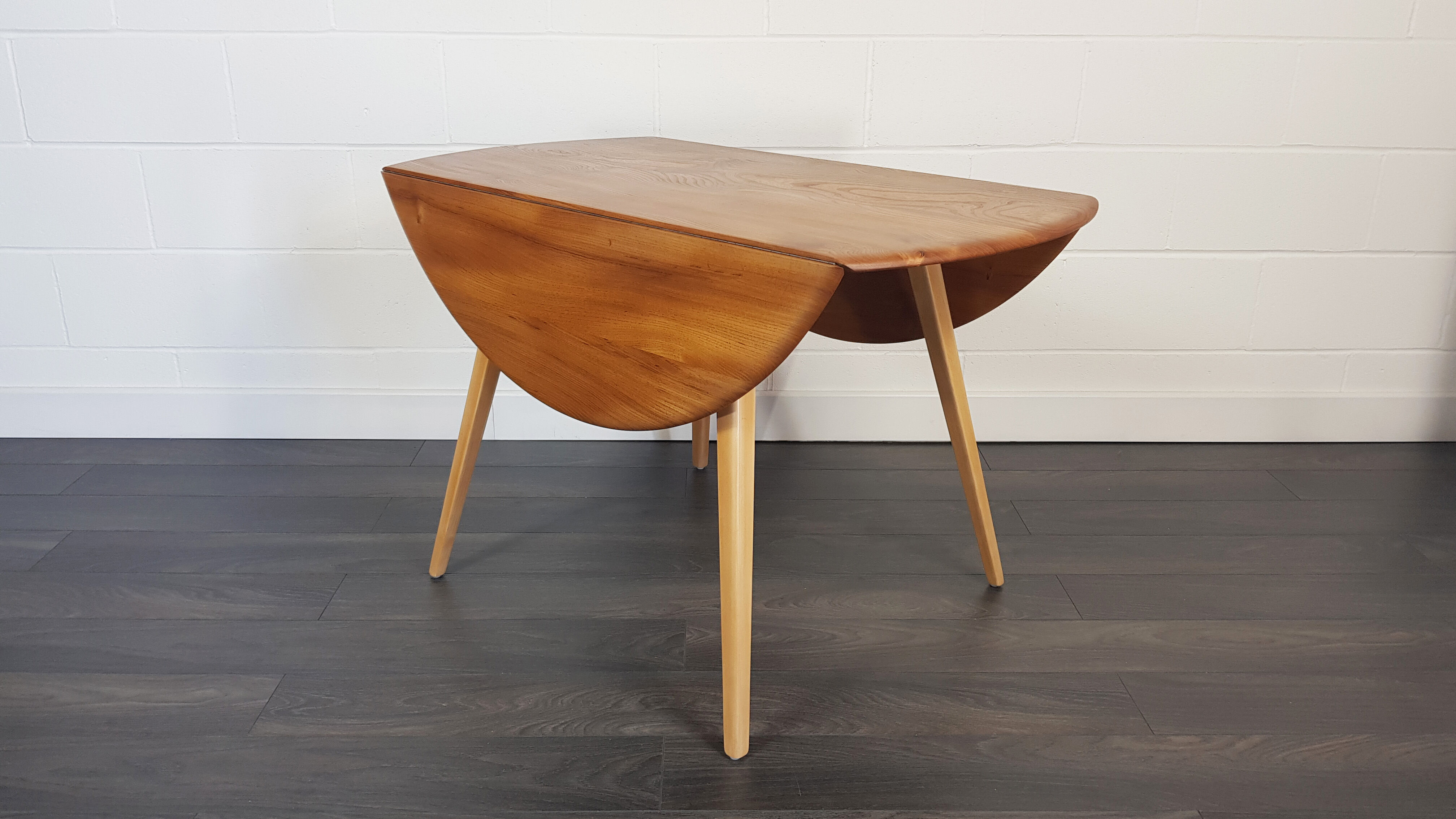 Ercol round drop leaf dining table, 1960s