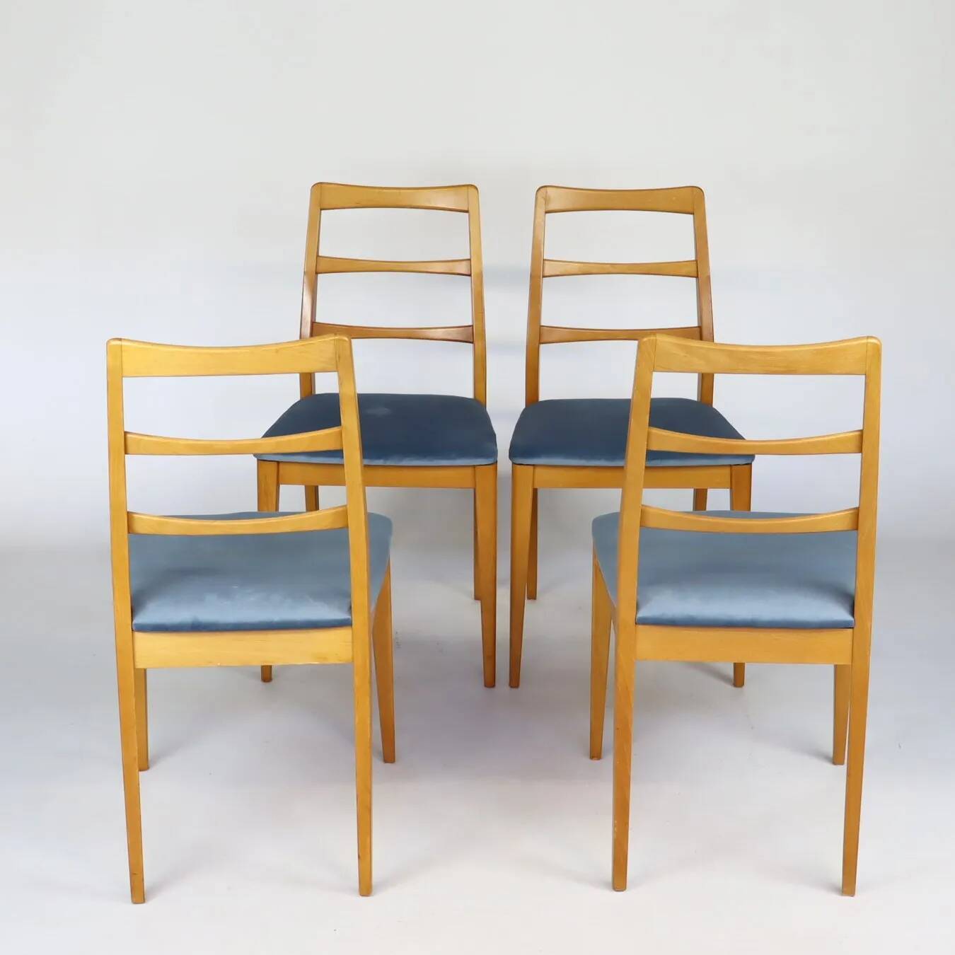 Set of four blue velvet Scandinavian chairs.