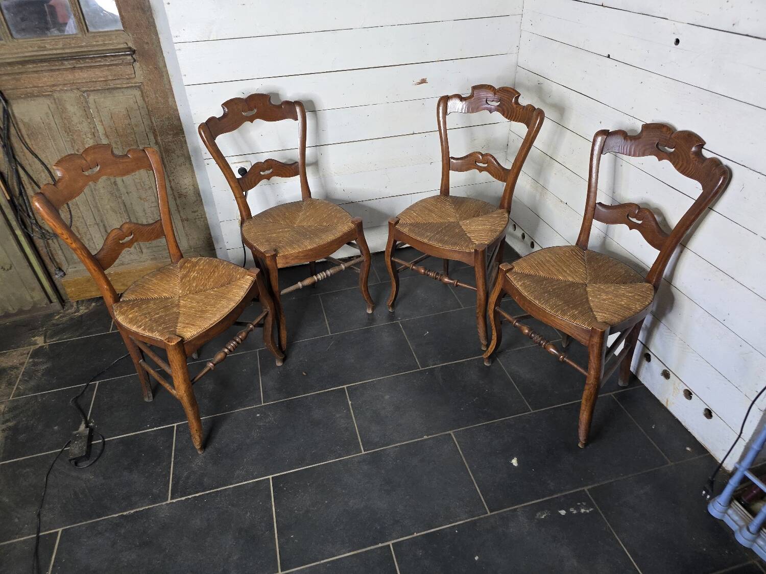 4 old straw chairs