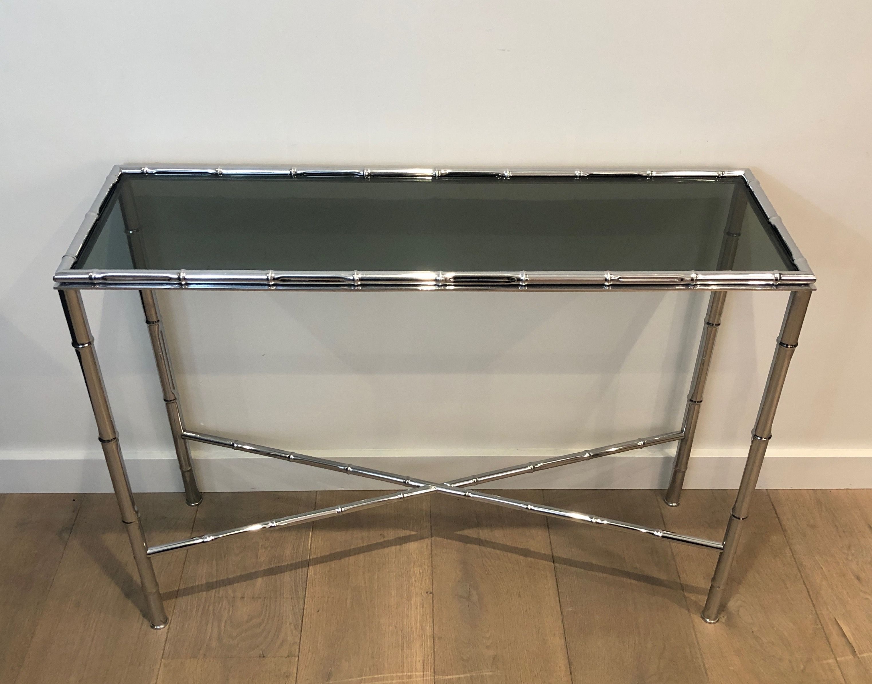 Console and chrome faux-bamboo mirror
