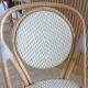 Pair of Parisian bistro chairs from Maison Louis Drucker in light Manila rattan.