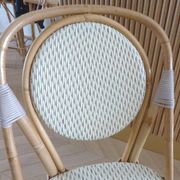 Pair of Parisian bistro chairs from Maison Louis Drucker in light Manila rattan.