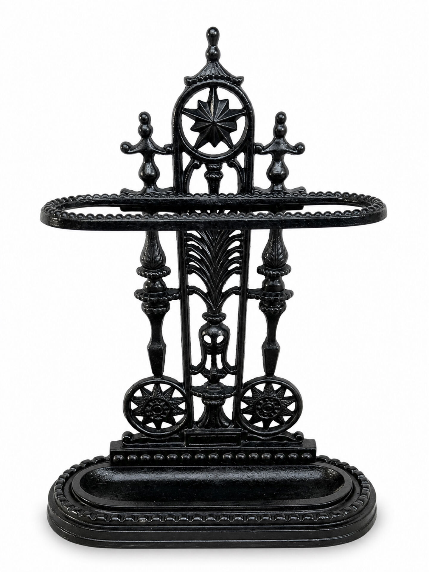 Antique cast iron umbrella stand, star-shaped openwork decoration, Victorian style.