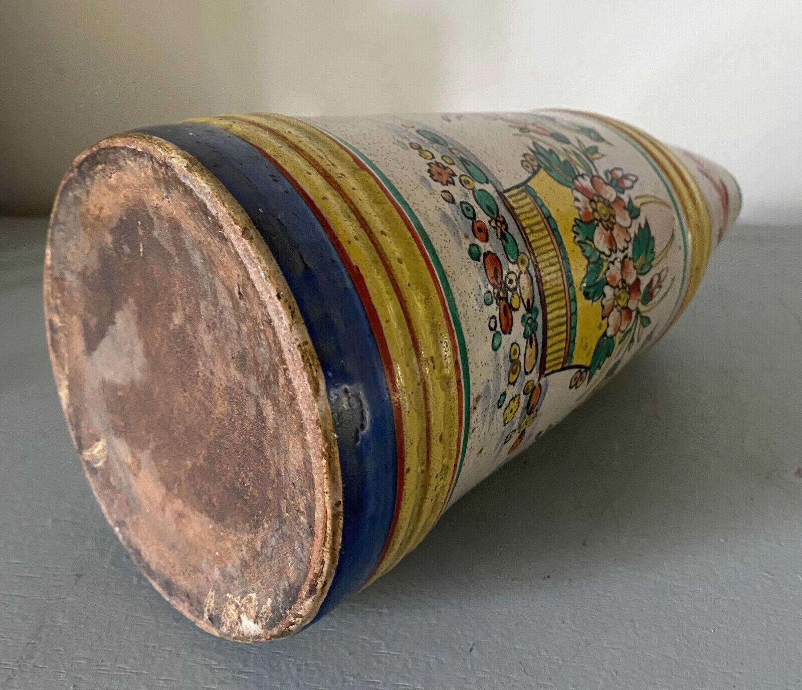 Old ceramic pitcher (18th century?) decorated with polychrome exotic birds