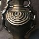 Black ceramic vase caught in naked women's bodies