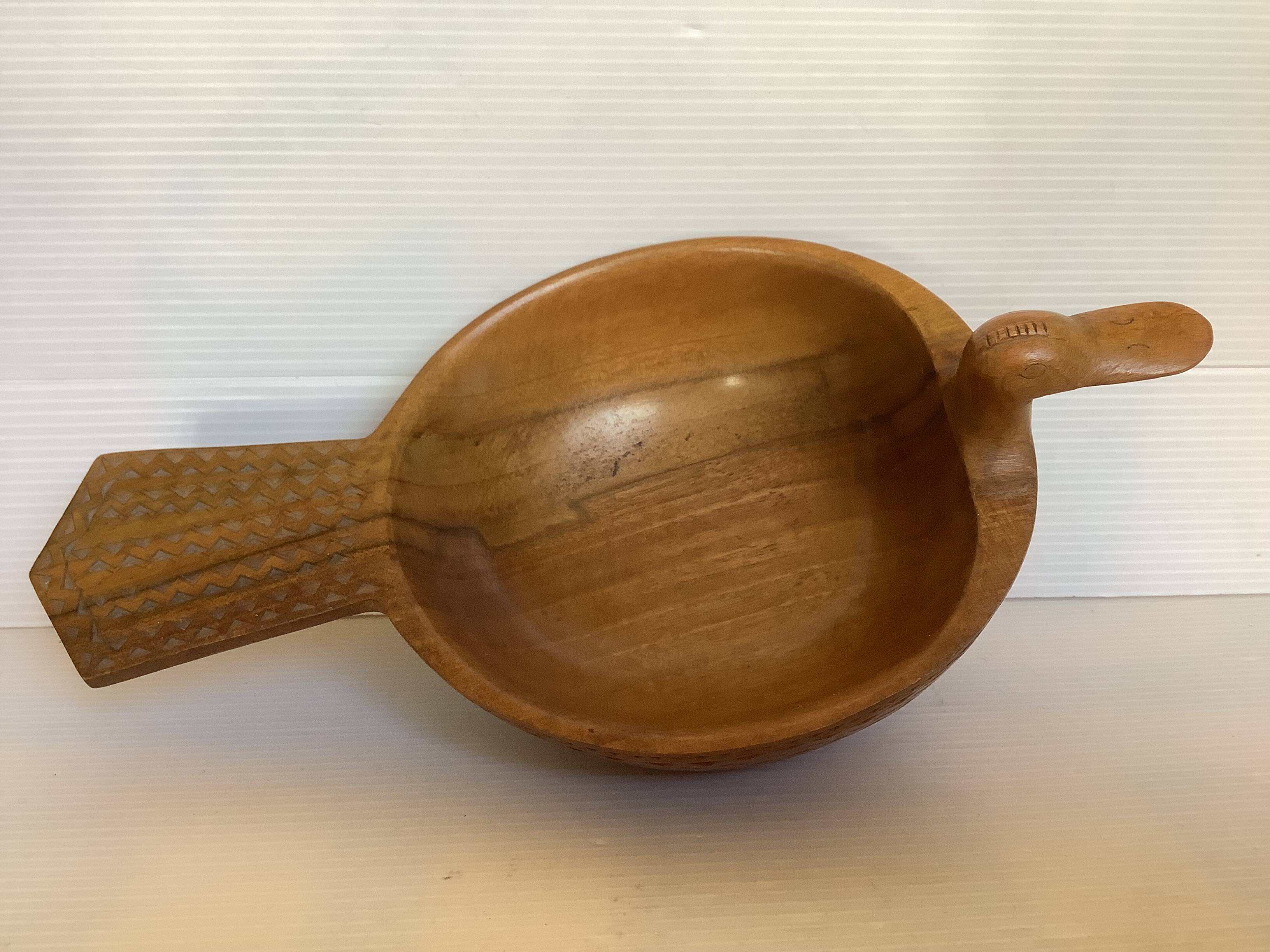 Carved wooden bird pocket