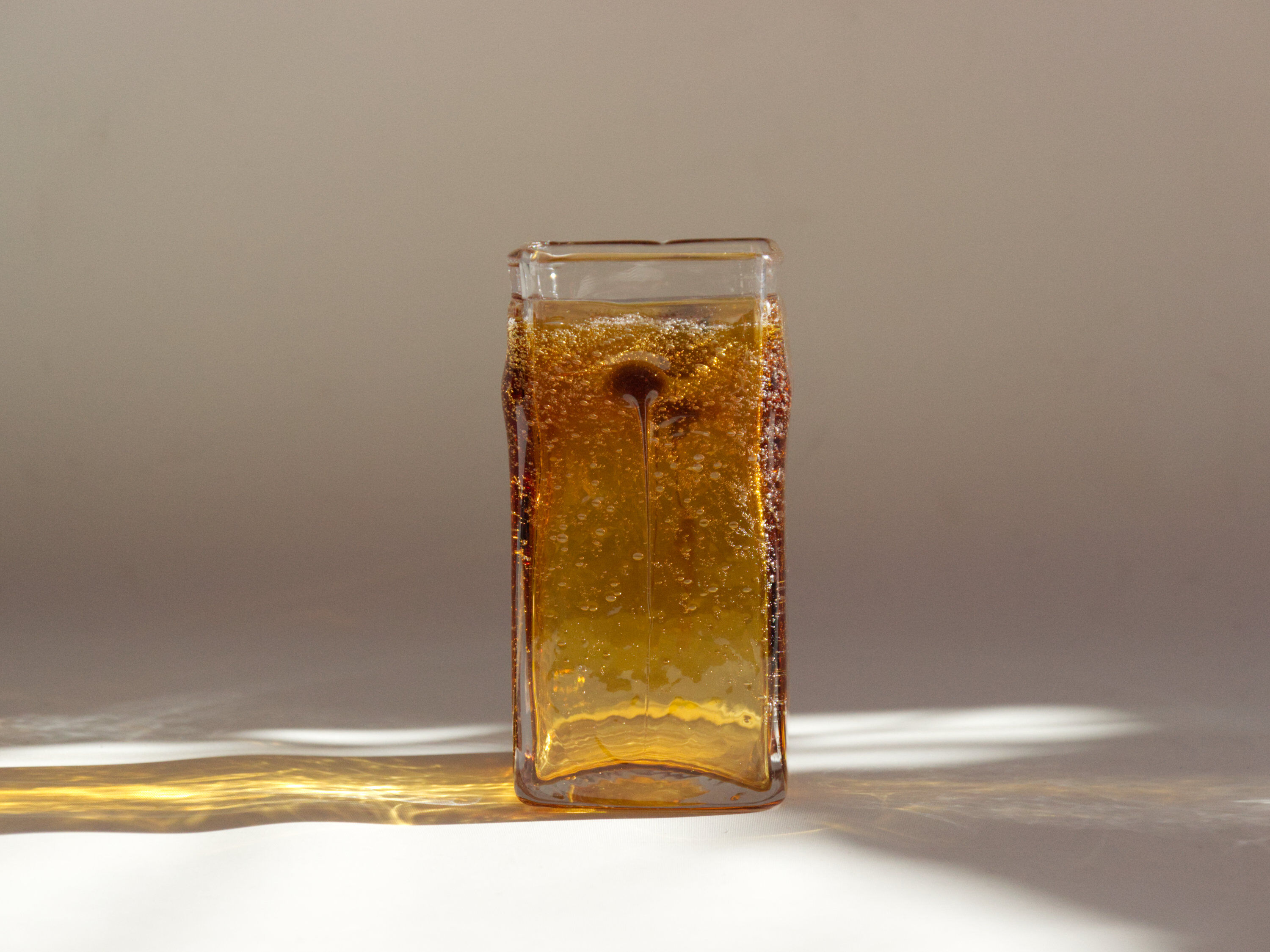 Amber vase made of bubbled glass