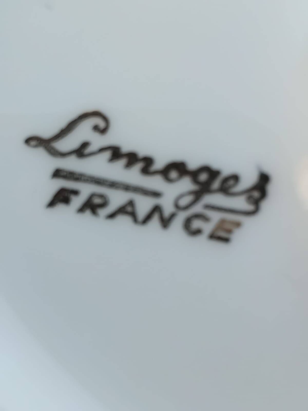 Vintage fine porcelain sauce boat with gold gilding.