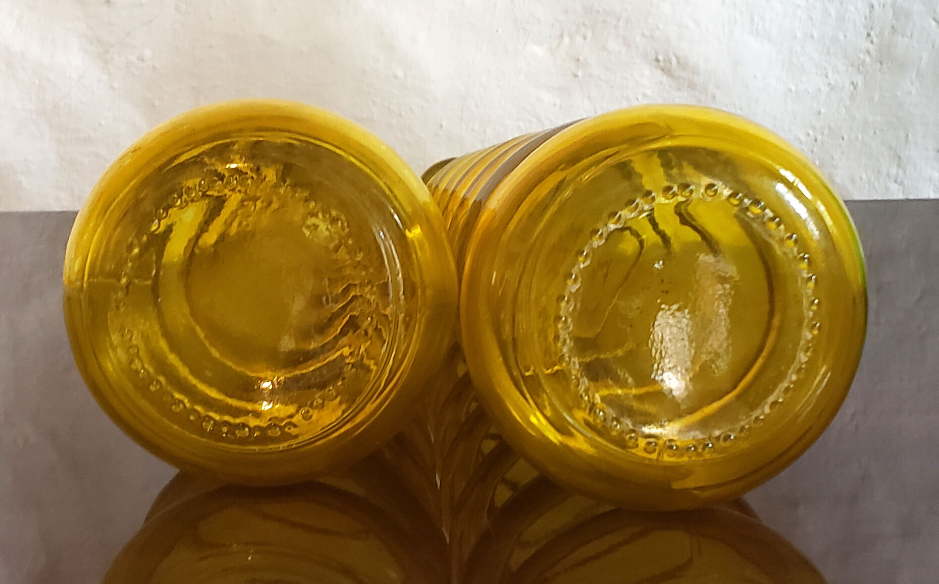 2 yellow vintage carafes