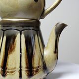 A pair of small vintage teapots in the Art Deco style reminiscent of Denbac.