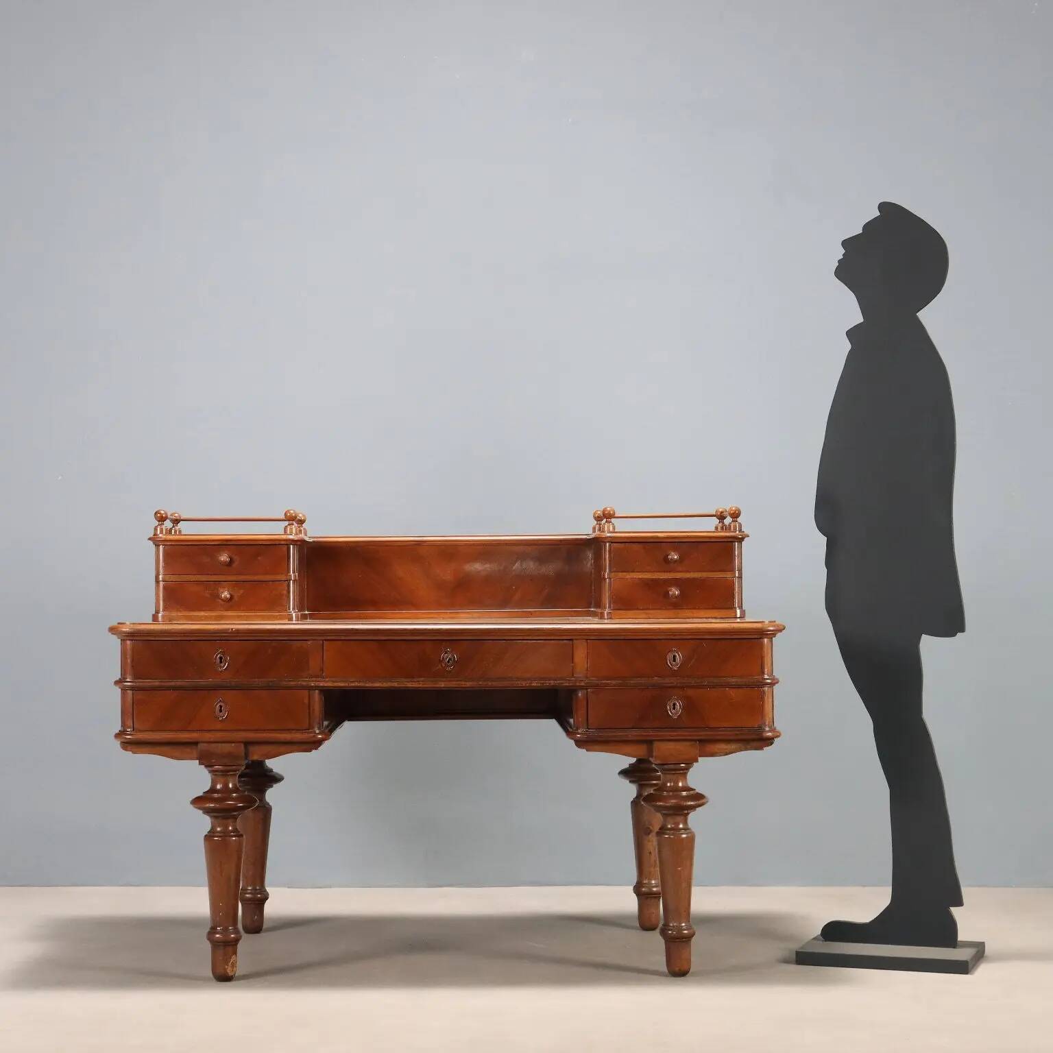 Antique walnut desk with a leather-covered top, Italy, late 19th century.