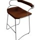 Bar stool with a backrest in aged silver metal and cognac leather, organic design.