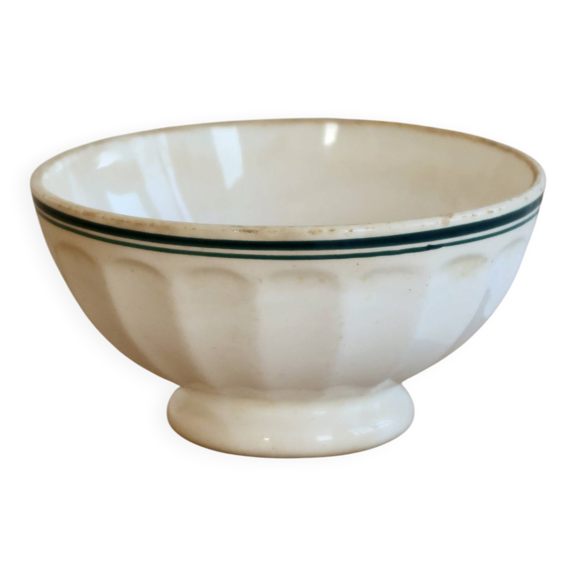 Old ivory ceramic bowl with double green trim.