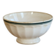 Old ivory ceramic bowl with double green trim.